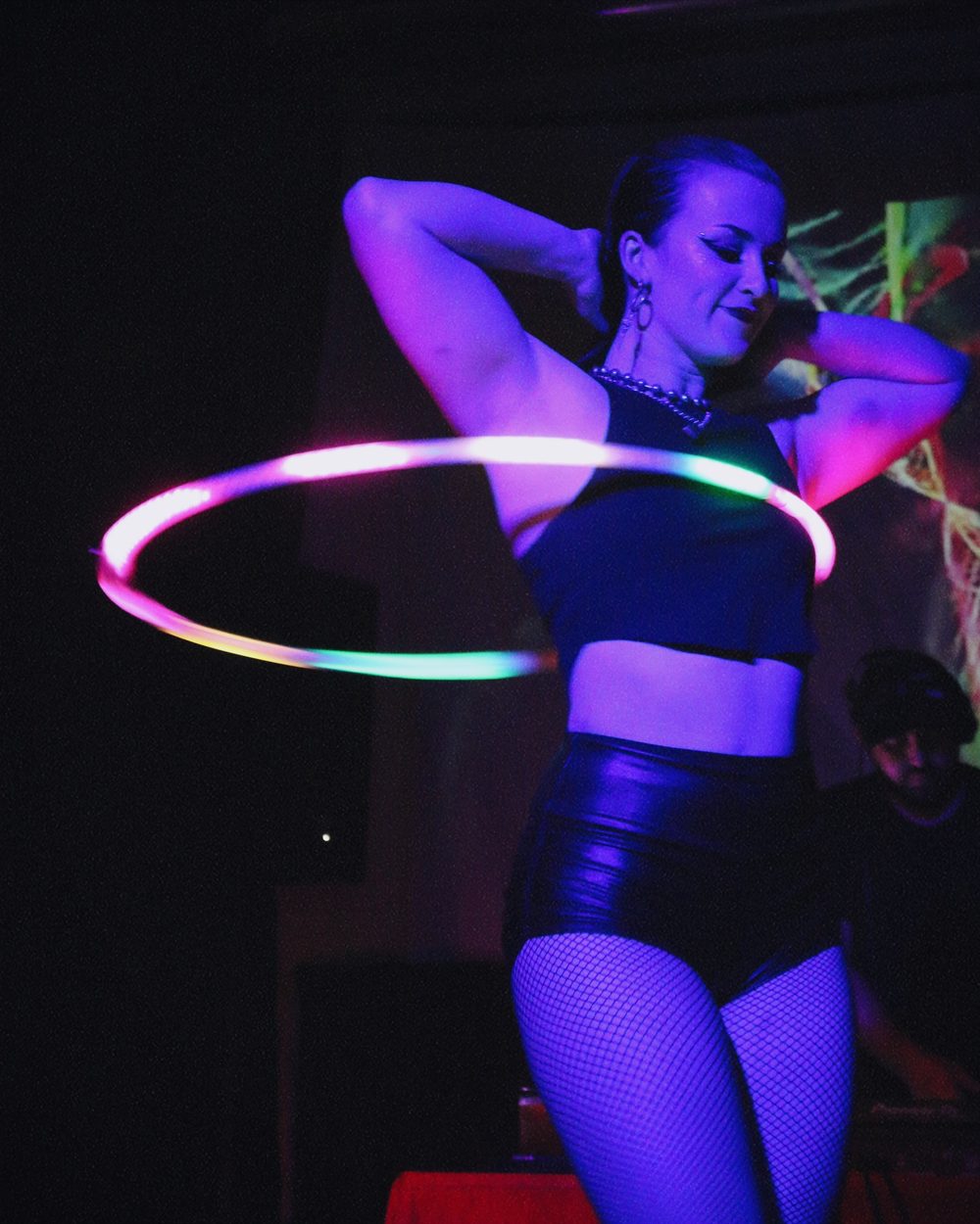 Lauren Leonesio performing with a glowing LED hoop